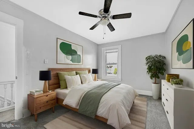 an empty room with chandelier fan