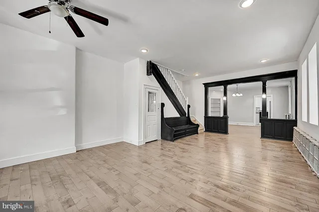 a view of an entryway with wooden floor