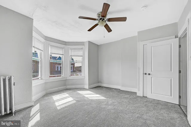 a bathroom with a bathtub a toilet and a shower