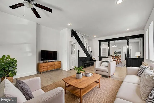 a living room with furniture and a flat screen tv