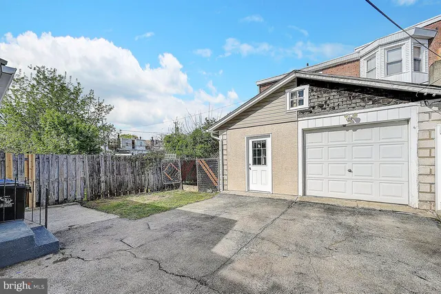a view of backyard with small cabin