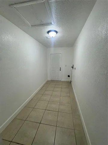 a view of hallway with a window