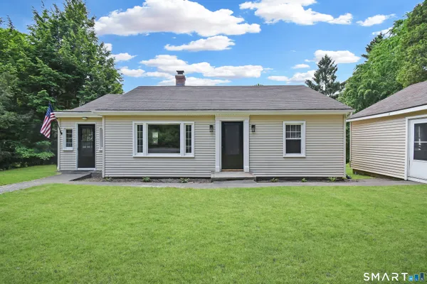 a house that has a big yard in front of it
