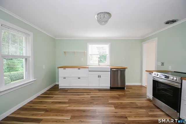 a room with a stove and a window