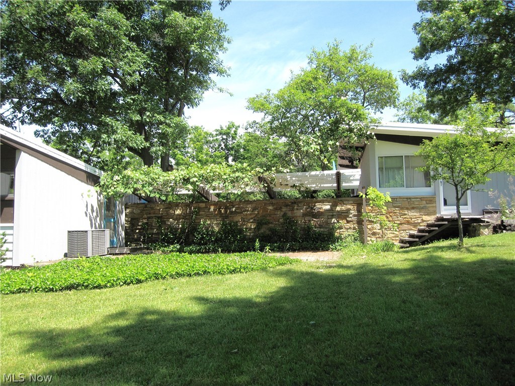 5 Pepper Ridge Road Cleveland, OH 44124 - Photo 23 of 33 A stone patio connects the master wing to the apartment on this property. Apartment was renovated a few years ago and has kitchen and full bathroom.
