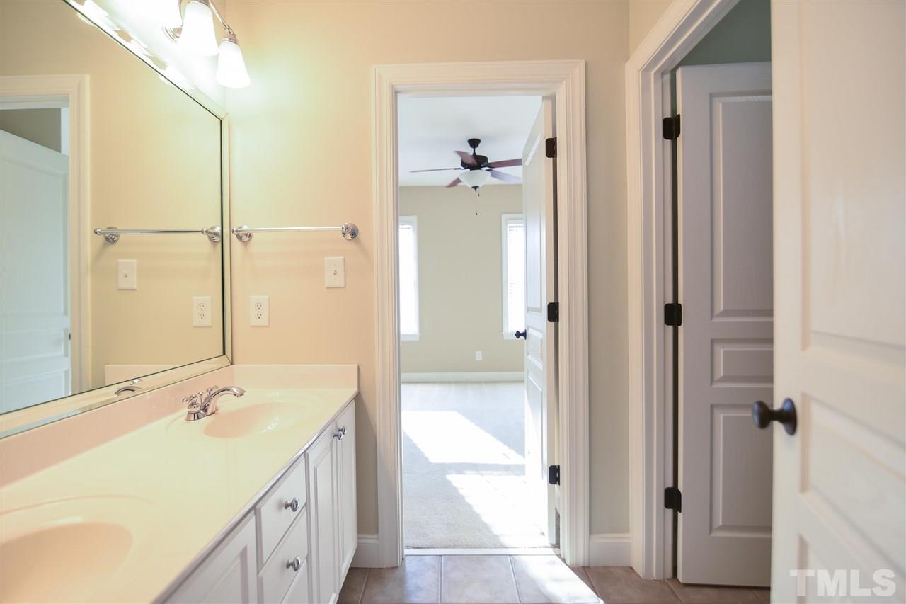 11323 Oakcroft Drive Raleigh, NC 27614 - Photo 18 of 25 Bathroom features double vanity and tub/shower combo.