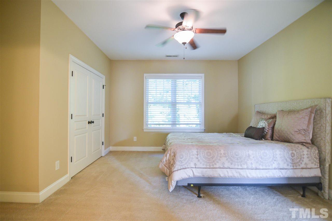 11323 Oakcroft Drive Raleigh, NC 27614 - Photo 19 of 25 Another spacious bedroom featuring plush carpet and ceiling fan!