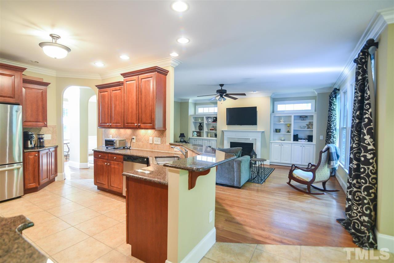 11323 Oakcroft Drive Raleigh, NC 27614 - Photo 9 of 25 A welcoming place to gather features hardwood floors, charming fireplace and custom built-ins!