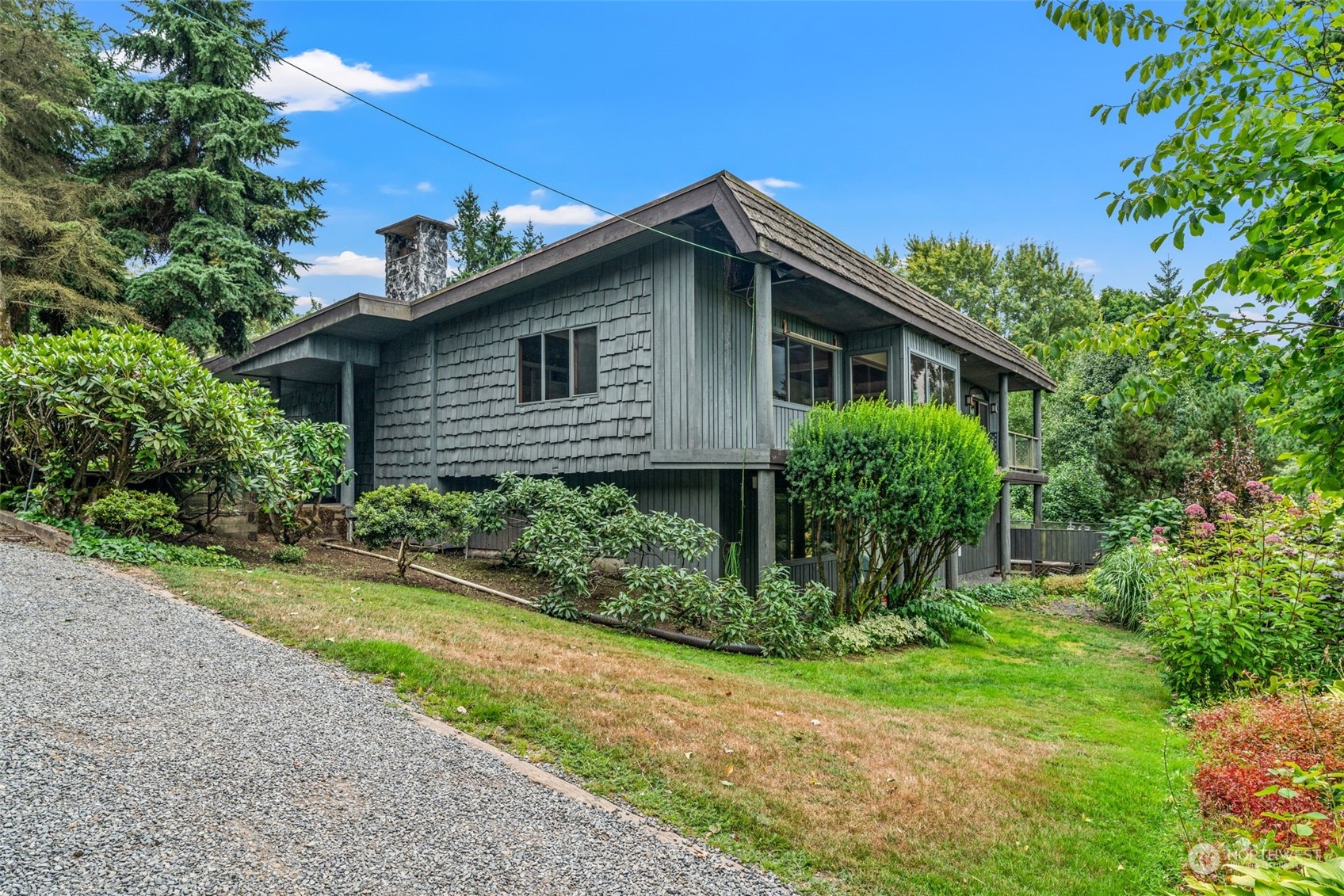 13210 Springhetti Road Snohomish, WA 98296 - Photo 3 of 38 a view of a house with yard and plants