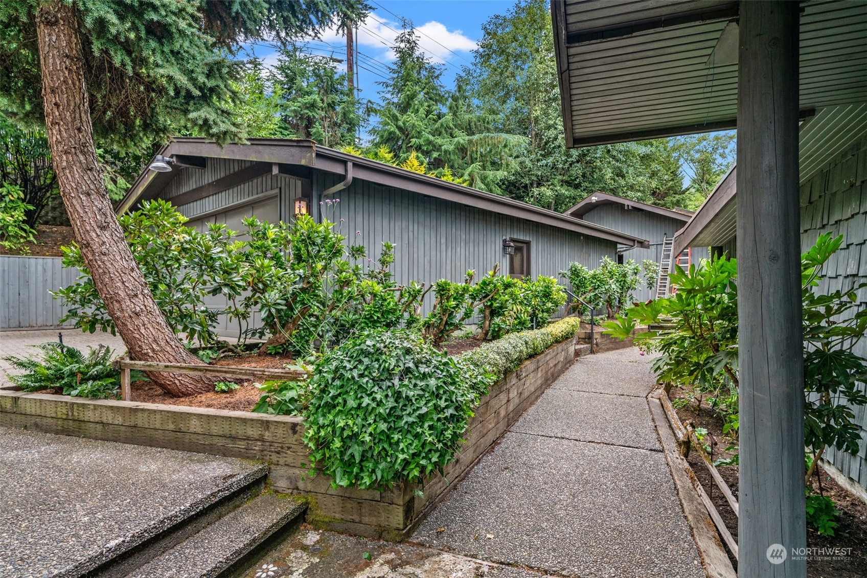 13210 Springhetti Road Snohomish, WA 98296 - Photo 4 of 38 a couple of flower plants in front of balcony