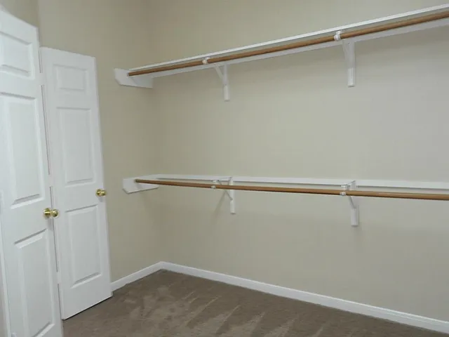 a view of a room with racks on the wall