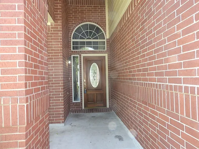 a view of door with wooden door