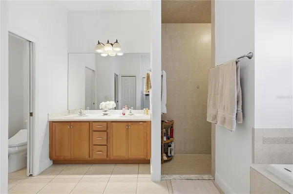 a bathroom with a sink a bathtub and a shower