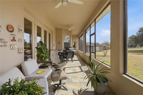 a view of a glass door with a yard from a window