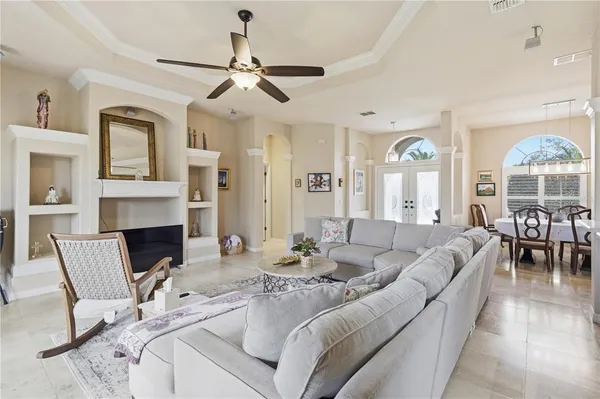 a large kitchen with a large counter top appliances and cabinets