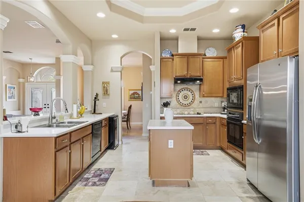 a kitchen with a stove and cabinets