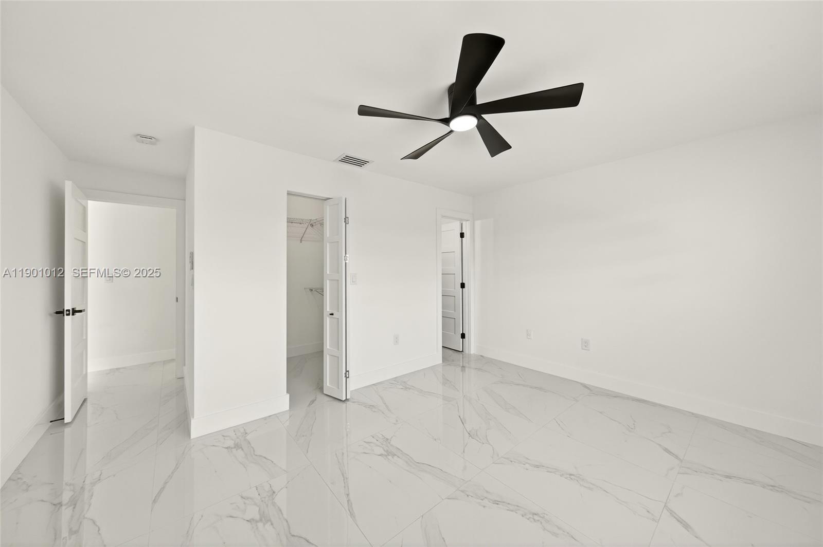 5913 Southwest 112th Terrace Cooper City, FL 33330 - Photo 15 of 31 a view of empty room with wooden floor and ceiling fan