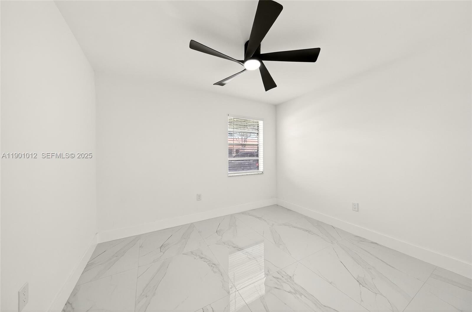 5913 Southwest 112th Terrace Cooper City, FL 33330 - Photo 18 of 31 a view of a small space with a ceiling fan