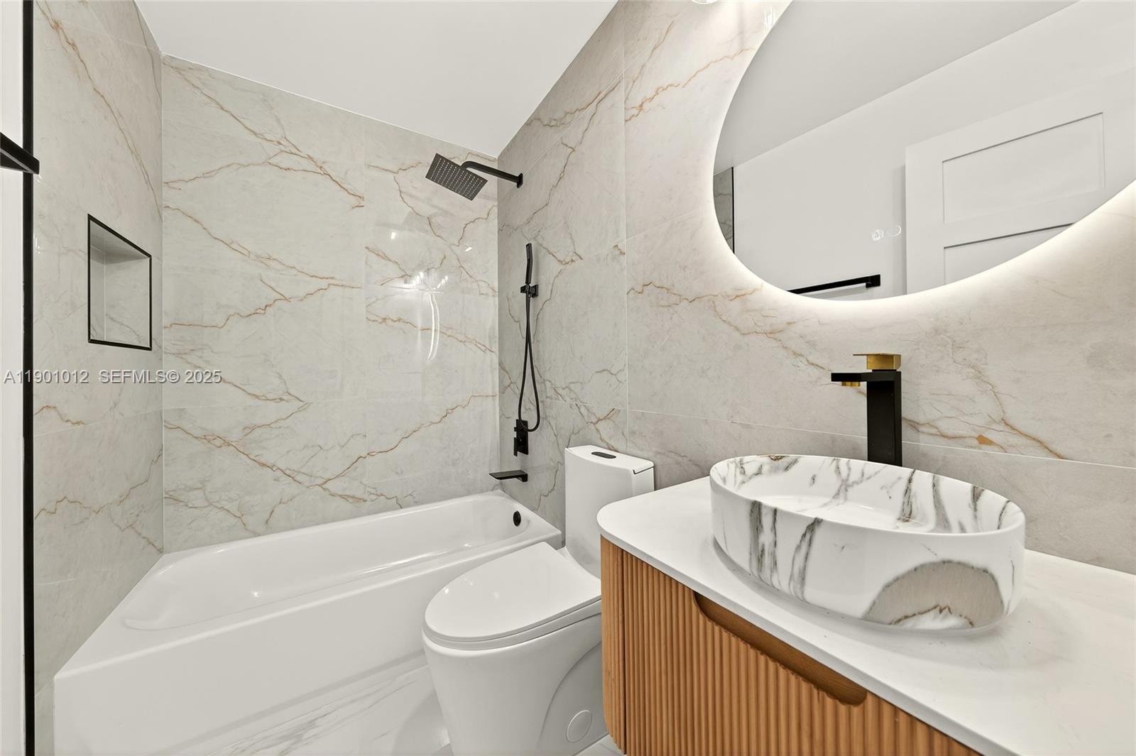 5913 Southwest 112th Terrace Cooper City, FL 33330 - Photo 20 of 31 a bathroom with a sink a toilet and bathtub