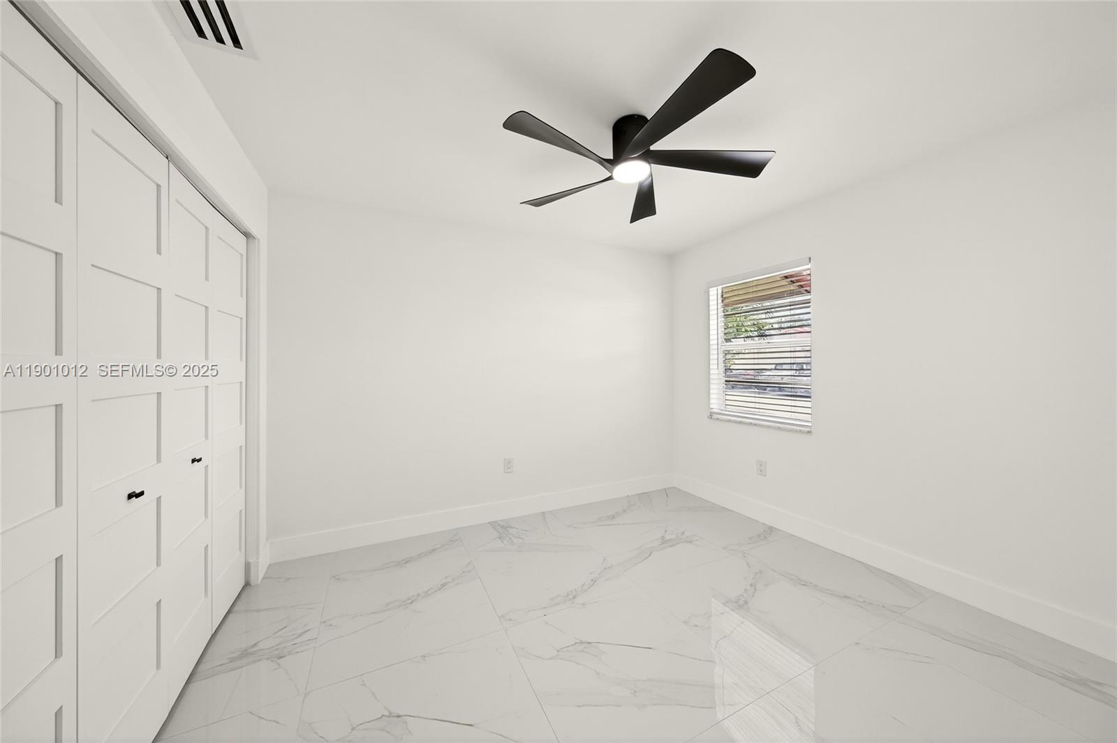 5913 Southwest 112th Terrace Cooper City, FL 33330 - Photo 21 of 31 an empty room with windows