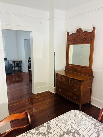 a room with a dresser and a table