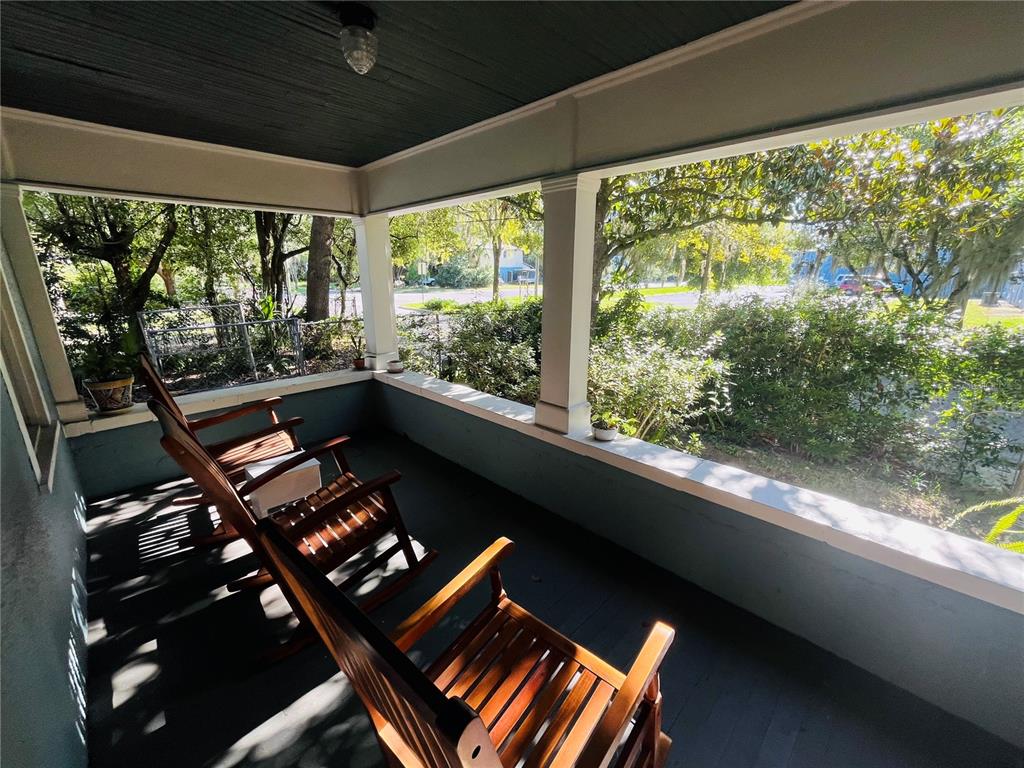 Undisclosed Address Gainesville, FL 32601 - Photo 5 of 25 a living room with large windows