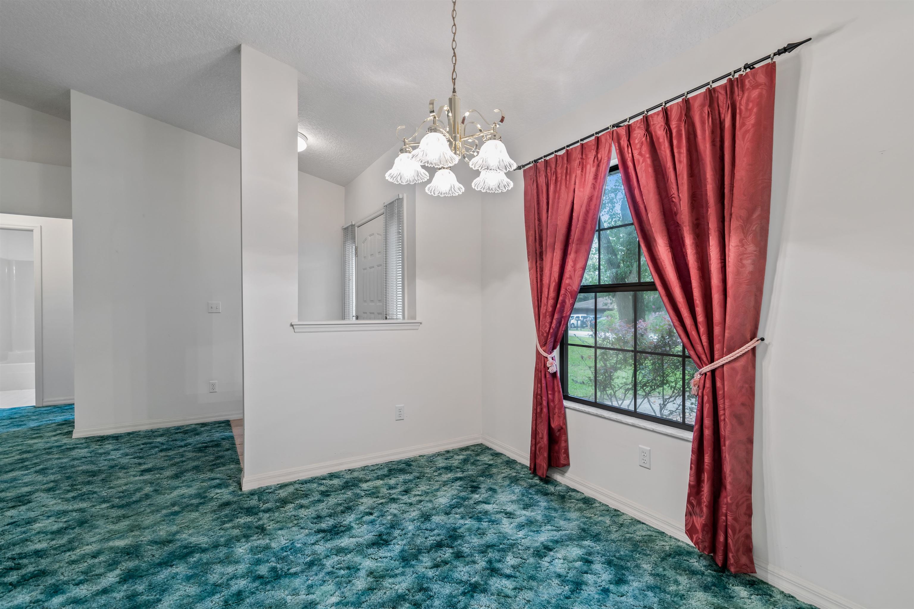 215 Cypress Road St. Augustine, FL 32086 - Photo 7 of 30 a view of a room with window and chandelier
