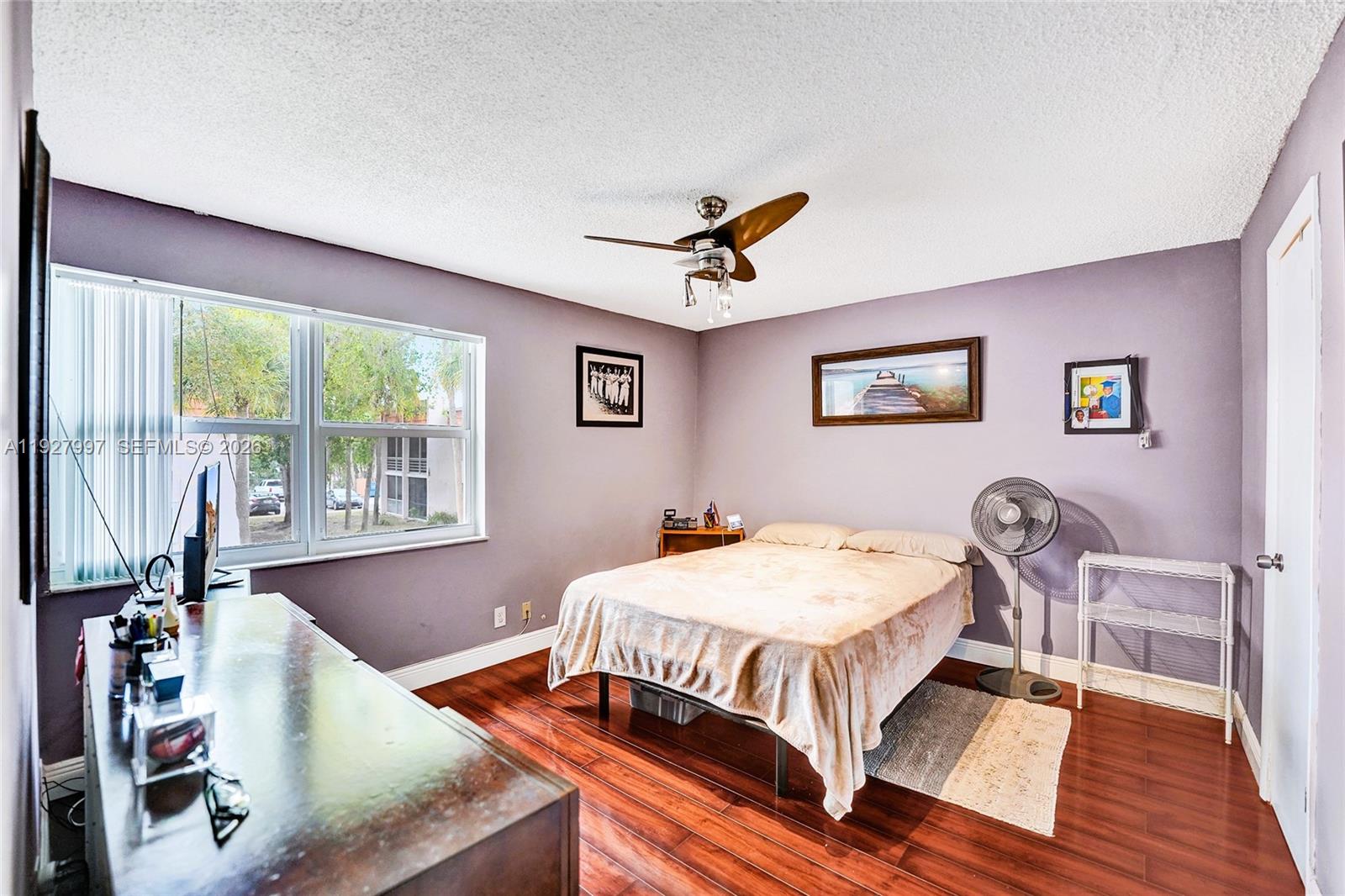 7610 Stirling Road, Unit 207C Davie, FL 33024 - Photo 11 of 16 a bedroom with furniture and a window