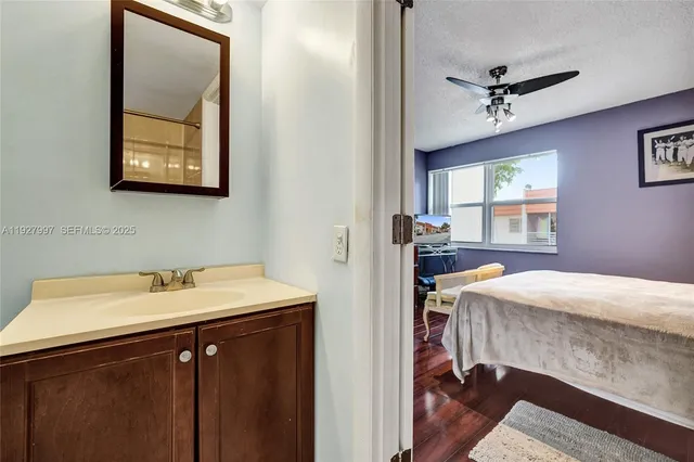 a bedroom with a bed and a table