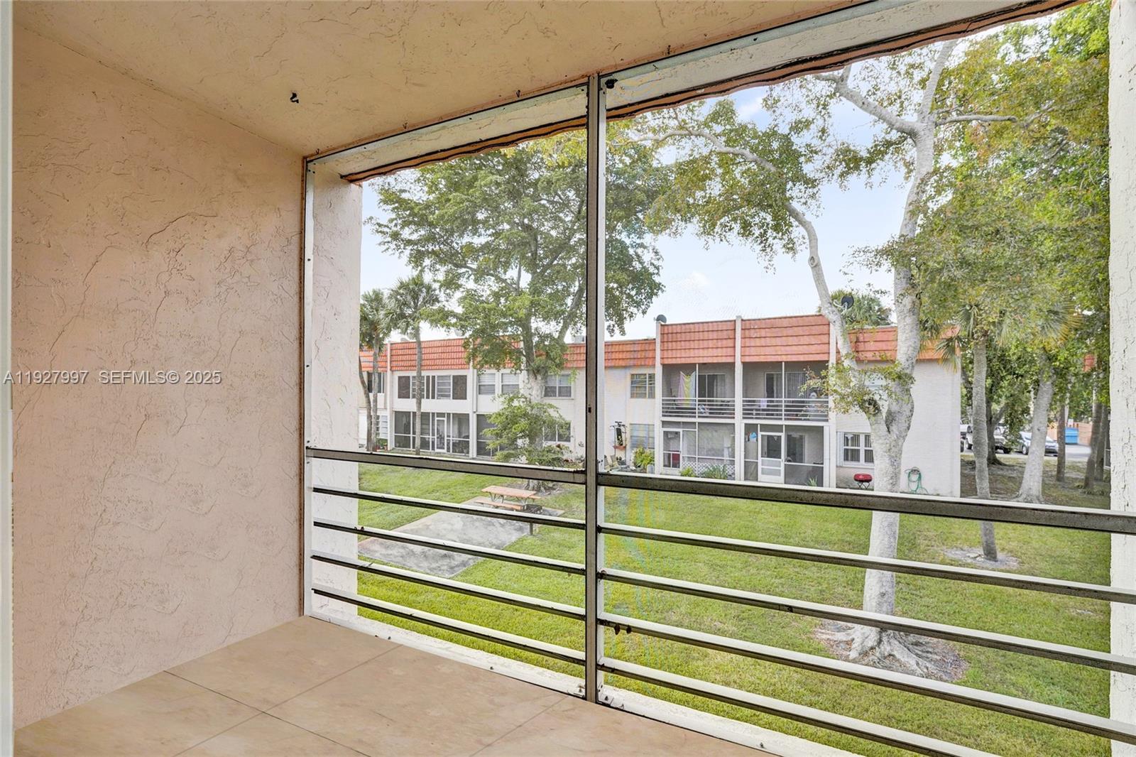 7610 Stirling Road, Unit 207C Davie, FL 33024 - Photo 14 of 16 a view of a large window with a outdoor space