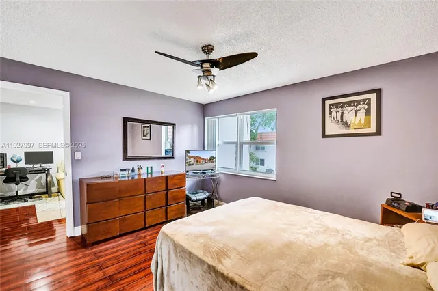 a bed room with bed and window