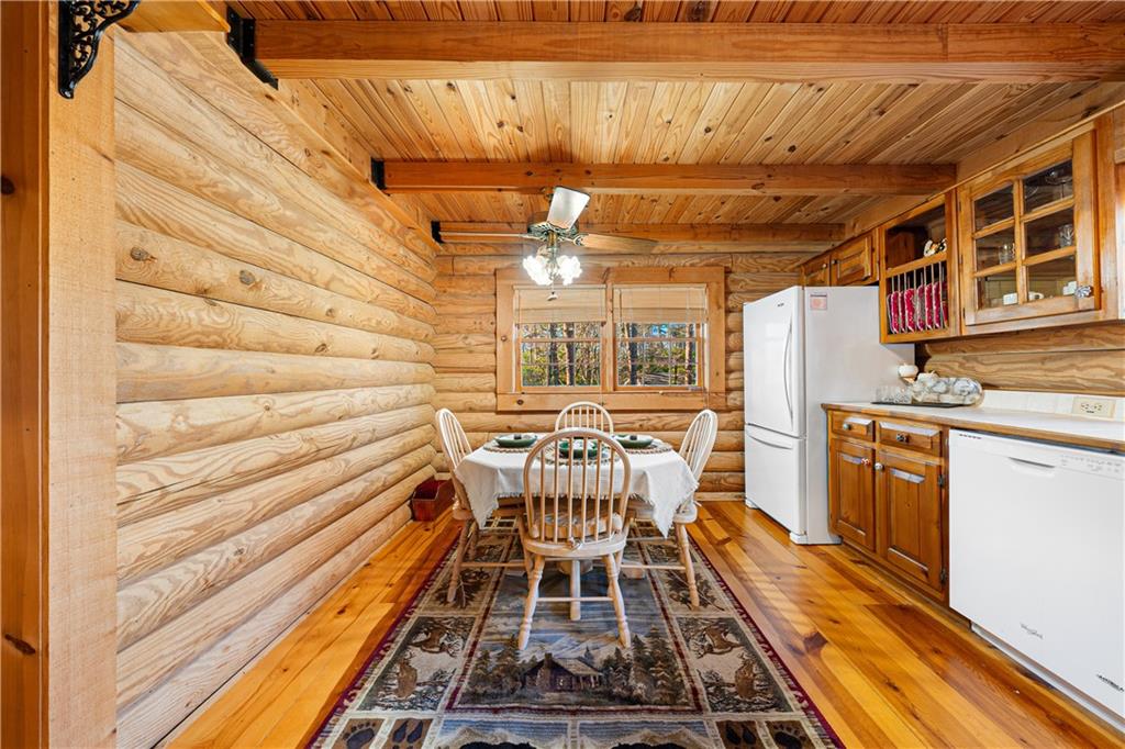 451 Pinecrest Road Sautee Nacoochee, GA 30571 - Photo 14 of 45 a view of a patio with table and chairs with wooden floor and fence