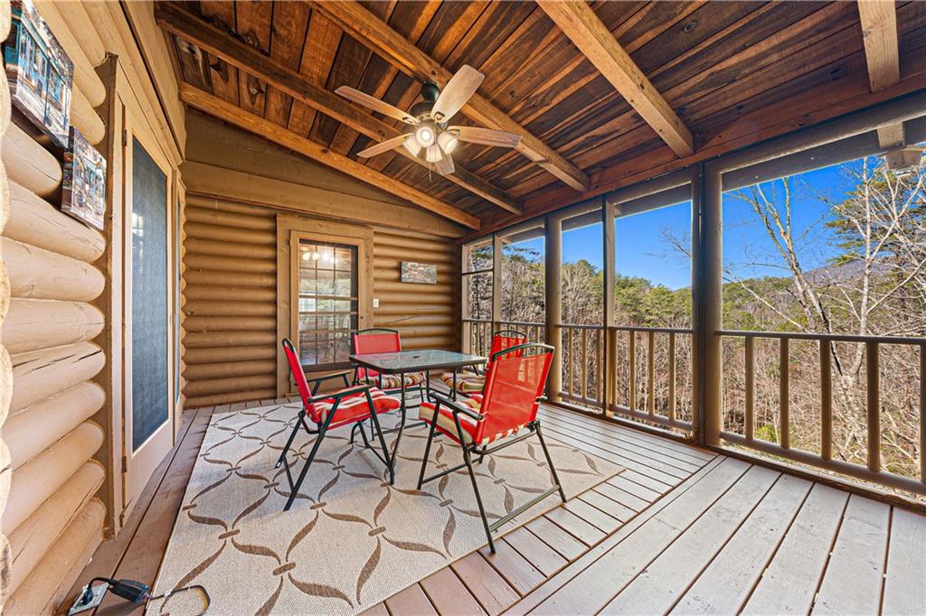 451 Pinecrest Road Sautee Nacoochee, GA 30571 - Photo 16 of 45 a roof deck with table and chairs and wooden floor