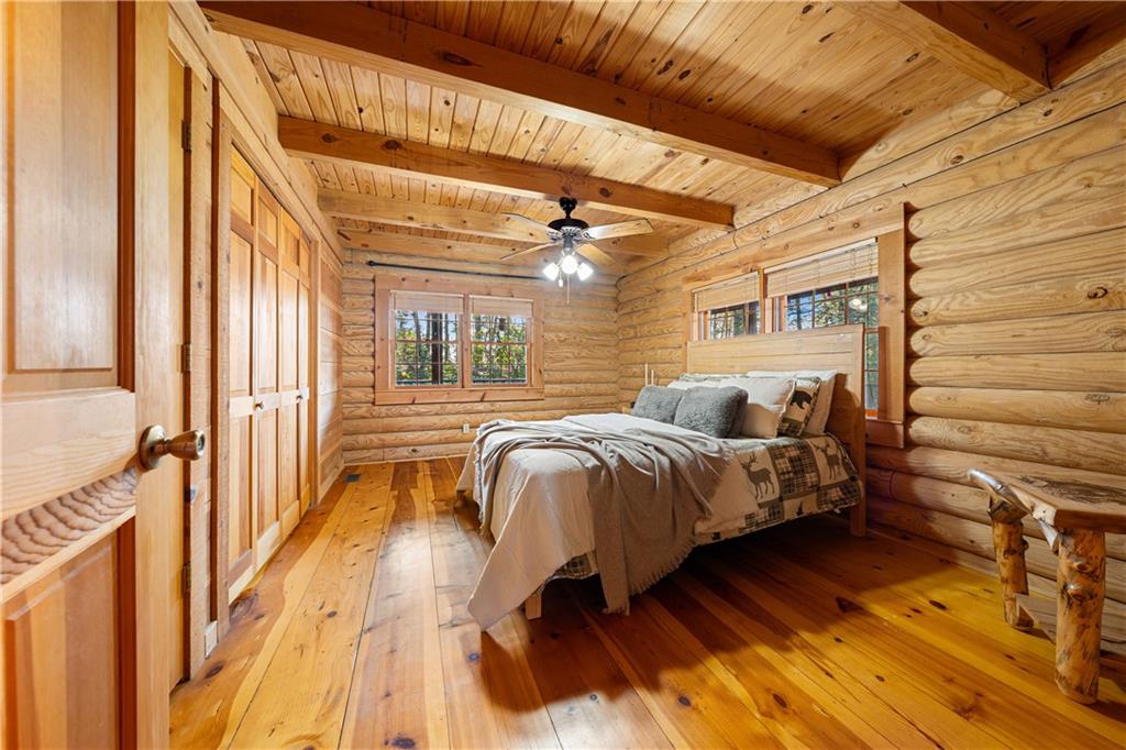 451 Pinecrest Road Sautee Nacoochee, GA 30571 - Photo 18 of 45 a bedroom with a bed and a large window with the outer view