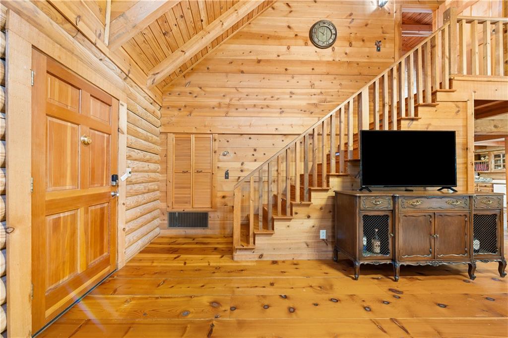 451 Pinecrest Road Sautee Nacoochee, GA 30571 - Photo 21 of 45 a living room with a flat screen tv and a fireplace
