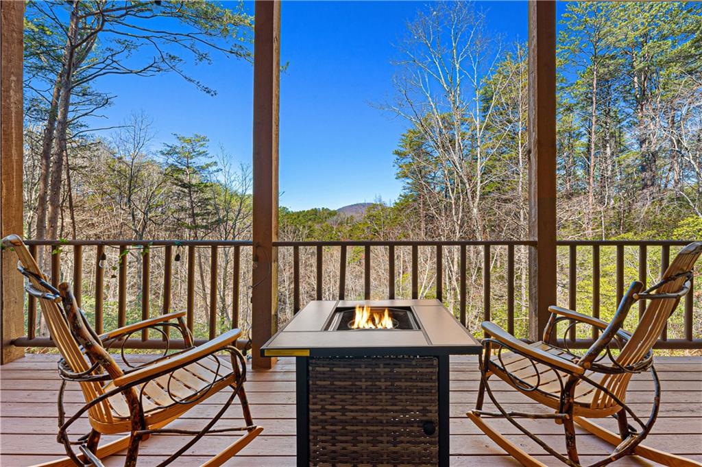 451 Pinecrest Road Sautee Nacoochee, GA 30571 - Photo 22 of 45 a view of a two chair and table in the balcony
