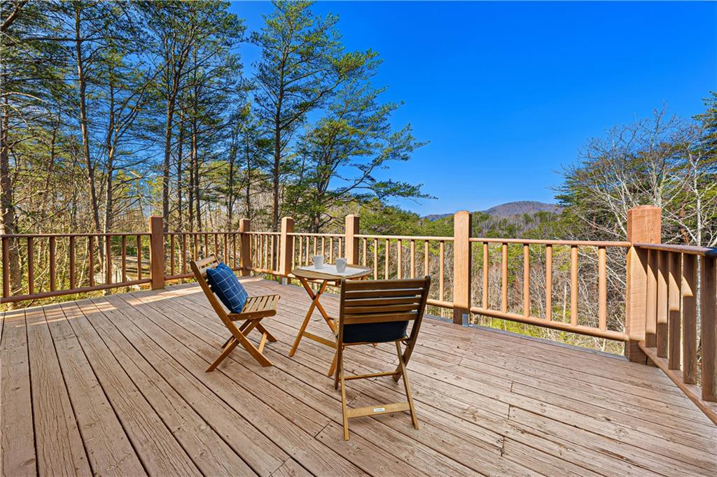 451 Pinecrest Road Sautee Nacoochee, GA 30571 - Photo 29 of 45 a view of a chairs on wooden deck