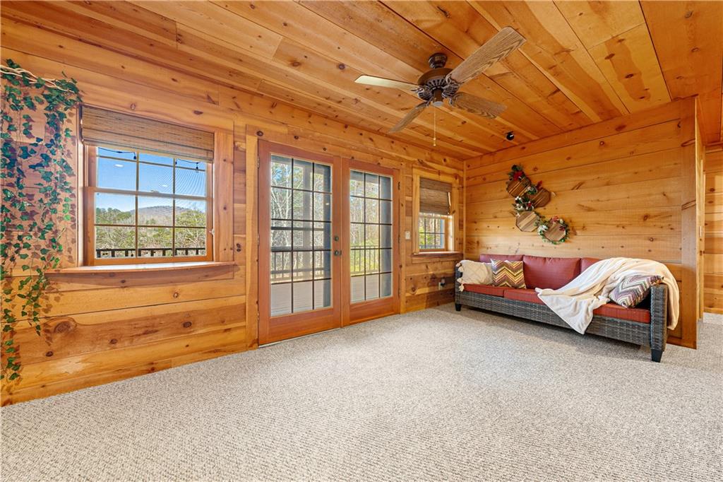 451 Pinecrest Road Sautee Nacoochee, GA 30571 - Photo 37 of 45 a bedroom with a bed and wooden floor