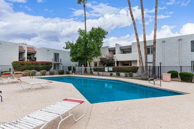a view of a garden with a fountain