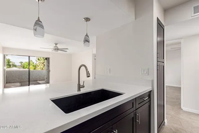 a kitchen with a sink and cabinets