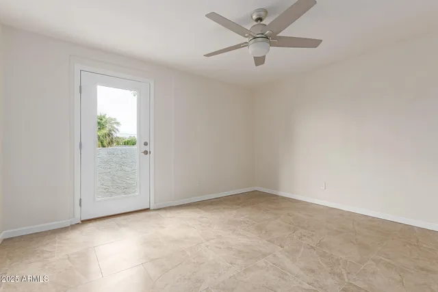 an empty room with fan