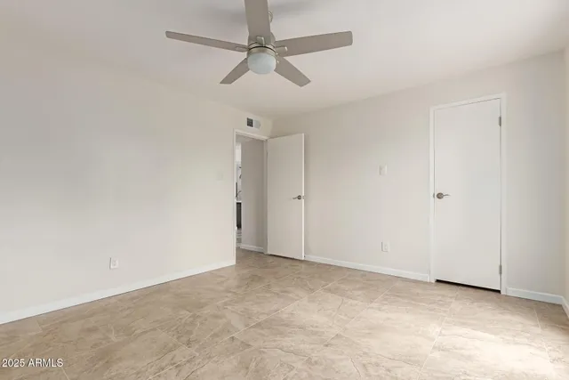 an empty room with fan