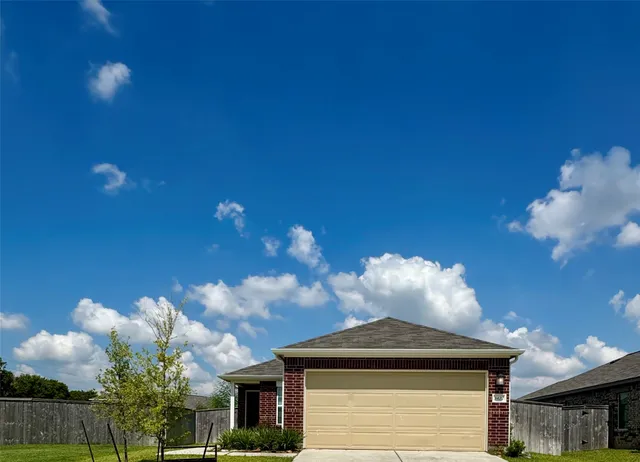 a row of houses with yard