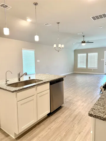 a bathroom with a double vanity sink and mirror