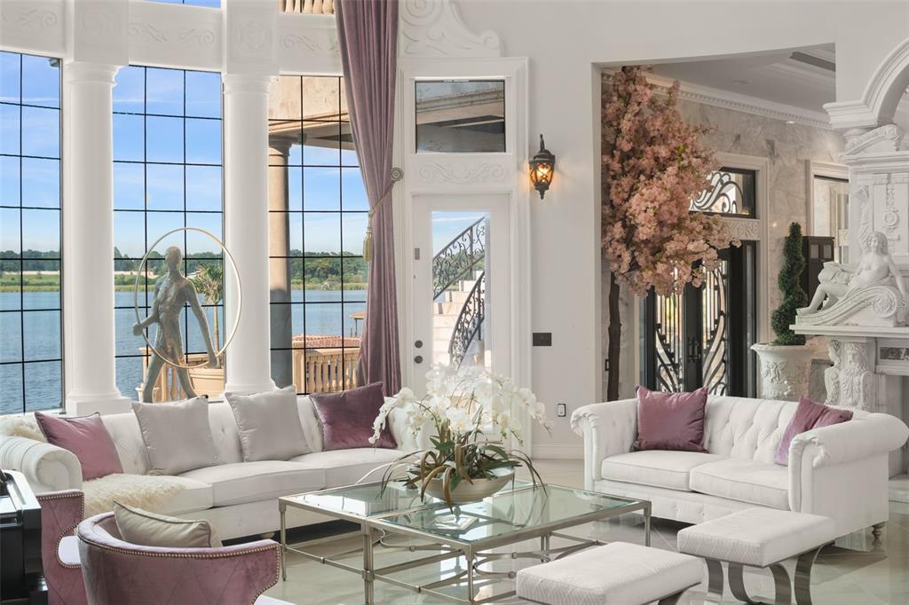 9639 Westover Roberts Road Windermere, FL 34786 - Photo 11 of 65 a living room with furniture and a large window