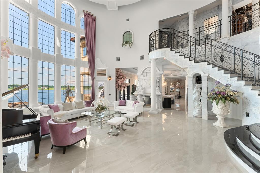 9639 Westover Roberts Road Windermere, FL 34786 - Photo 12 of 65 a building with furniture and floor to ceiling windows