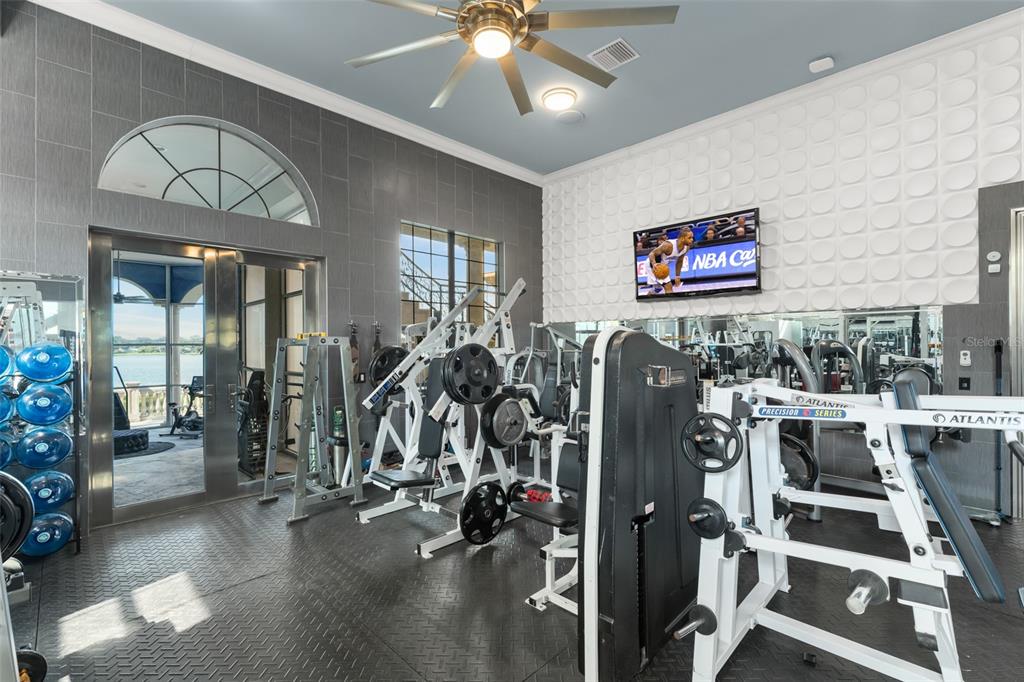 9639 Westover Roberts Road Windermere, FL 34786 - Photo 16 of 65 a view of a room with gym equipment