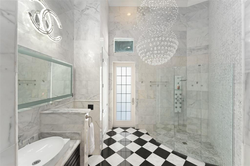 9639 Westover Roberts Road Windermere, FL 34786 - Photo 19 of 65 a bathroom with a shower a toilet and a sink