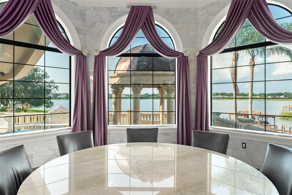 9639 Westover Roberts Road Windermere, FL 34786 - Photo 31 of 65 a living room with a bed and a large window