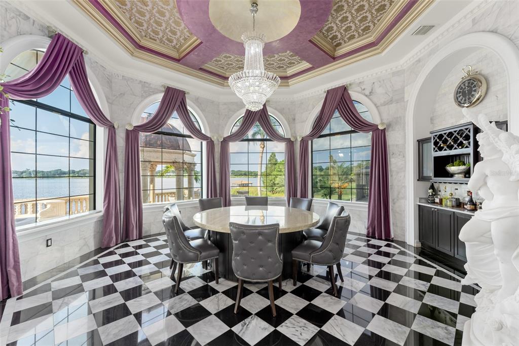9639 Westover Roberts Road Windermere, FL 34786 - Photo 33 of 78 a dining room with furniture a chandelier and a rug